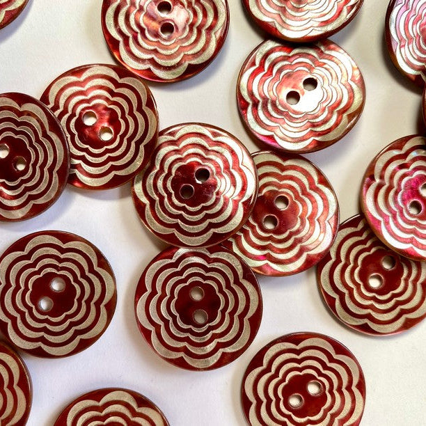 Red and white patterned buttons on a light background