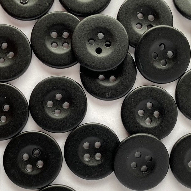 Pattern of black buttons on a white background