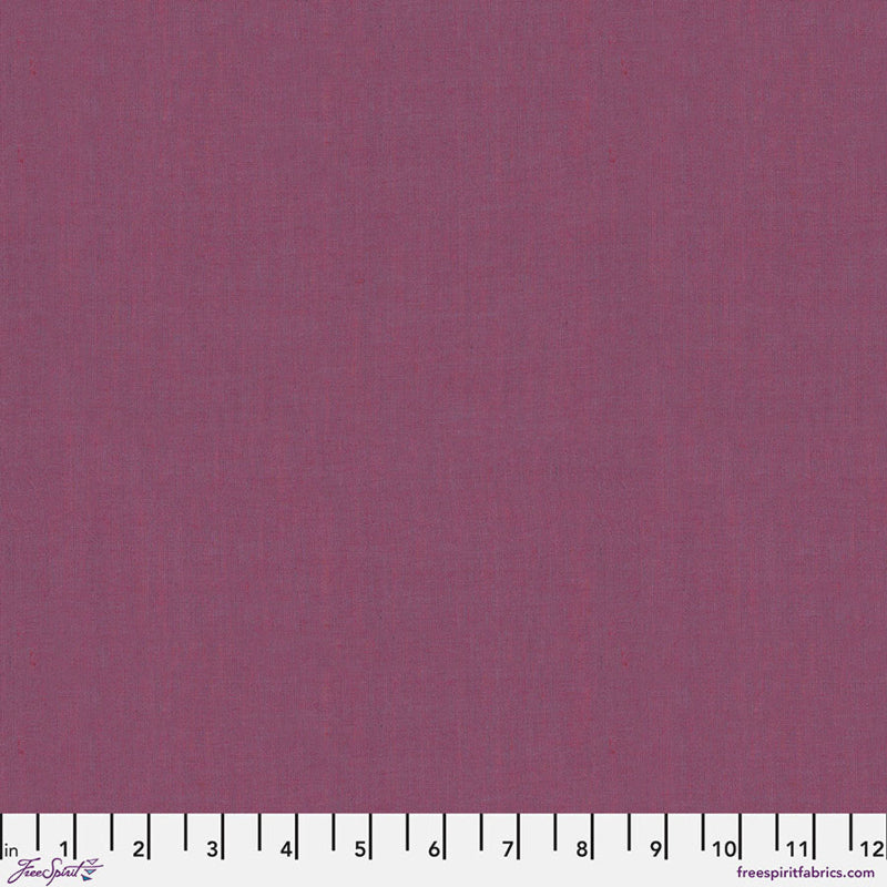 Solid purple fabric swatch with a ruler at the bottom