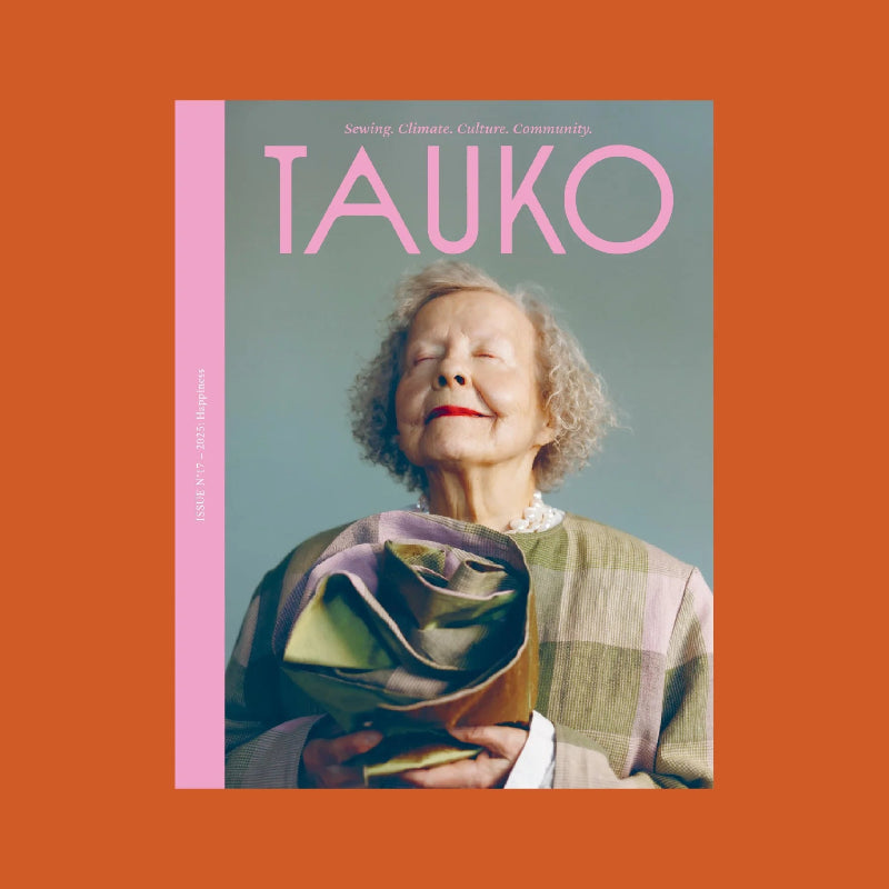 Tauko magazine cover with a person wearing a colorful garment on an orange background