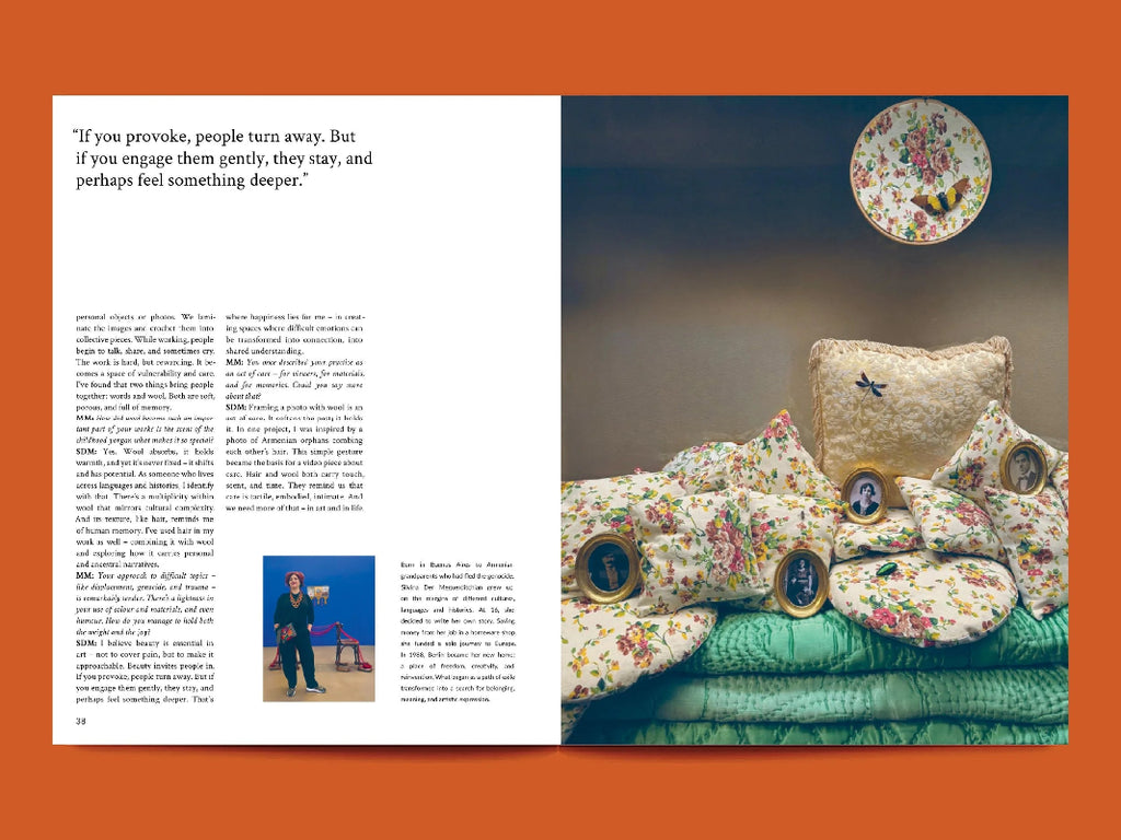 Book open to a page with decorative pillows and a moonlit sky illustration.