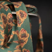 Floral-patterned bias tape on a dark background