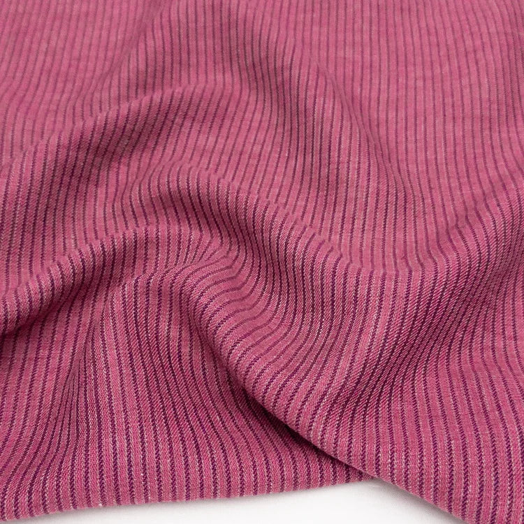Close-up of pink ribbed fabric texture