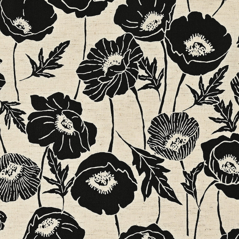 Black floral pattern on a beige fabric background