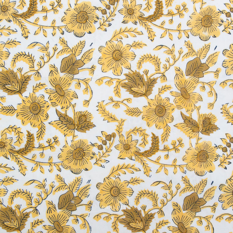 Fabric with a pattern of yellow flowers and leaves on a white background