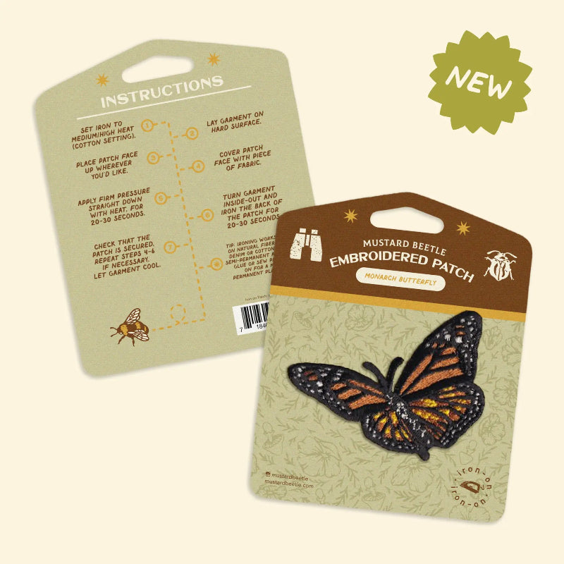 Mustard Beetle embroidered butterfly patch with packaging and instructions on a beige background