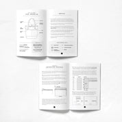 Open book with technical drawings and text on a white background