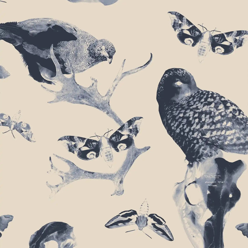 Pattern of birds, butterfly, and deer skull on a beige fabric