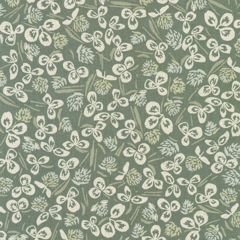 Orchard Run Patterned fabric with white floral design on a green background