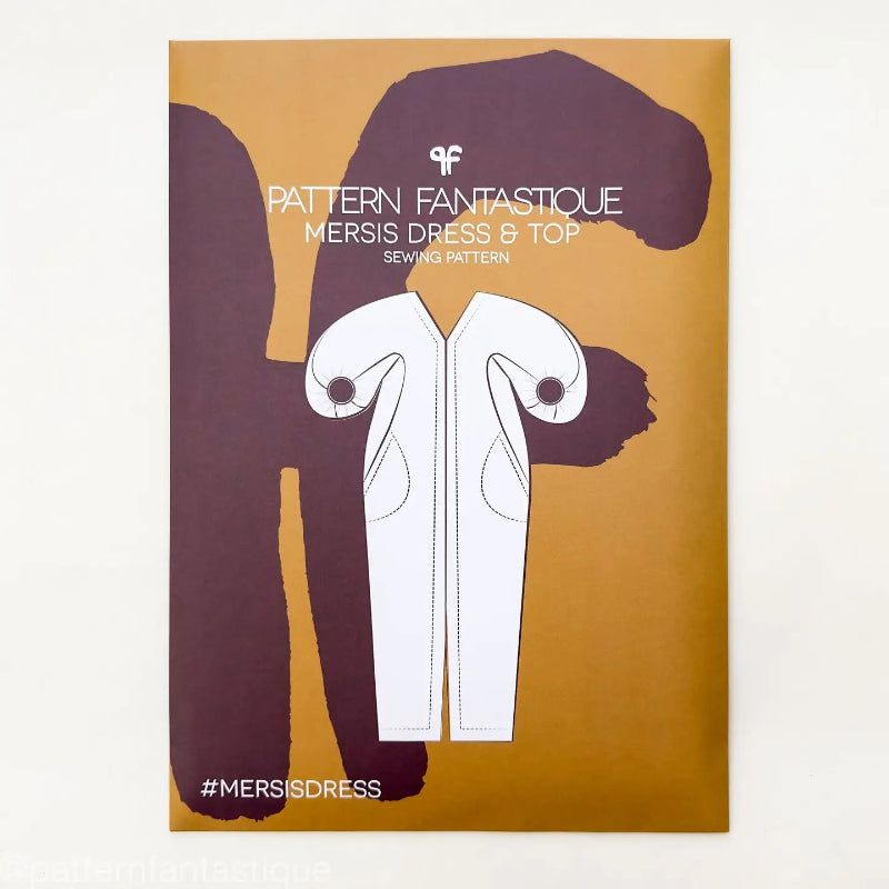 Sewing pattern cover for a dress and top with a brown background