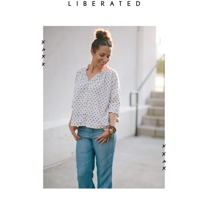 Woman wearing a polka dot top and jeans with 'Sew Liberated' branding.