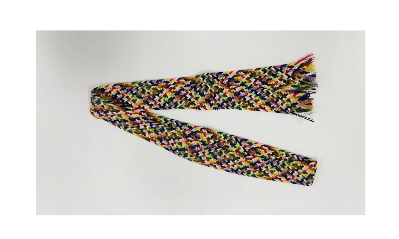 Multicolored braided scarf on a white background