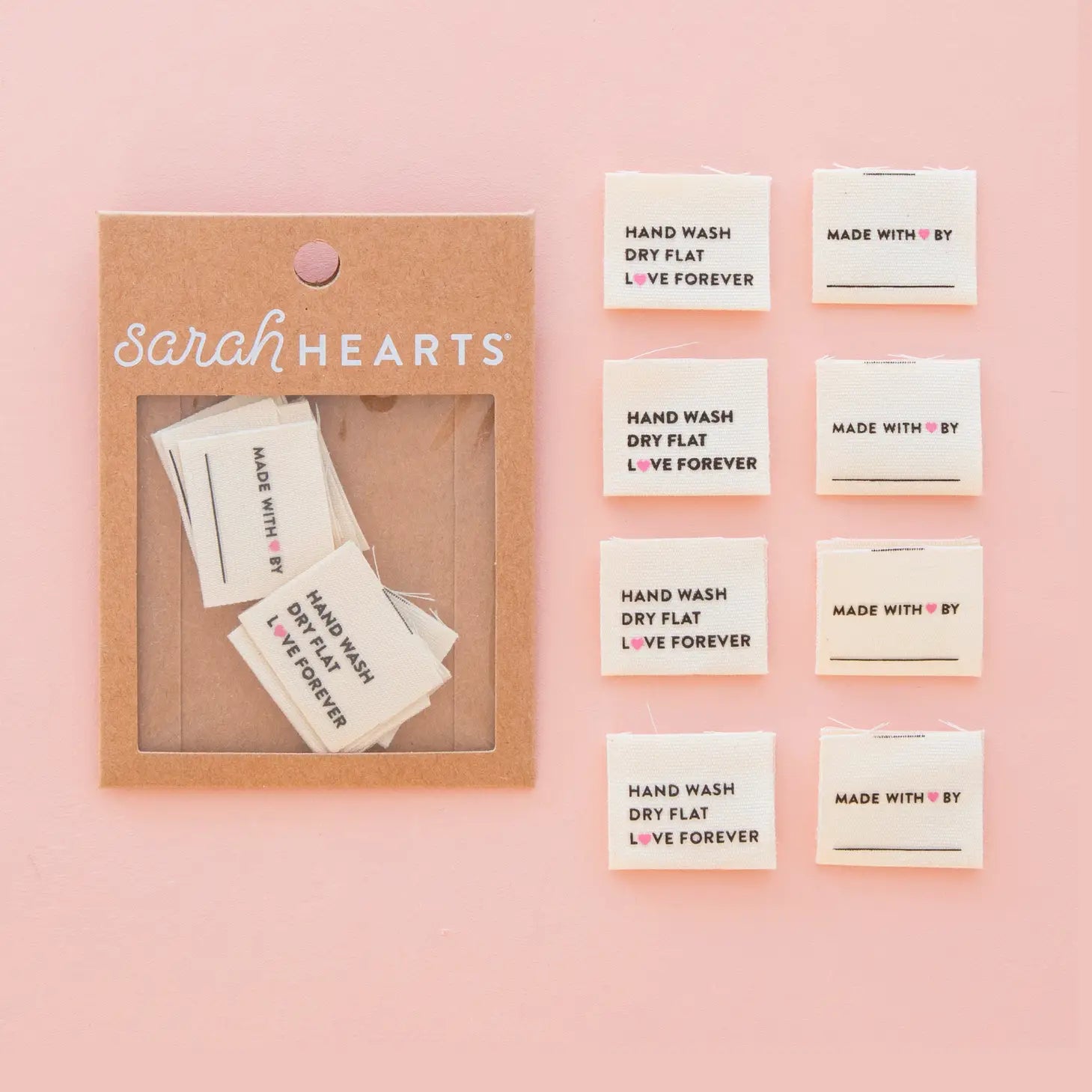Packaging of 'Sarah Hearts' with small cards on a pink background