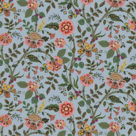 Floral pattern fabric with pink, green, and yellow flowers on a blue background