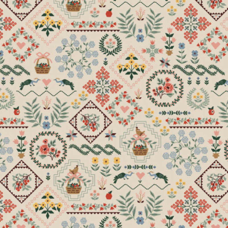 Off white fabric with floral embroidery designs.