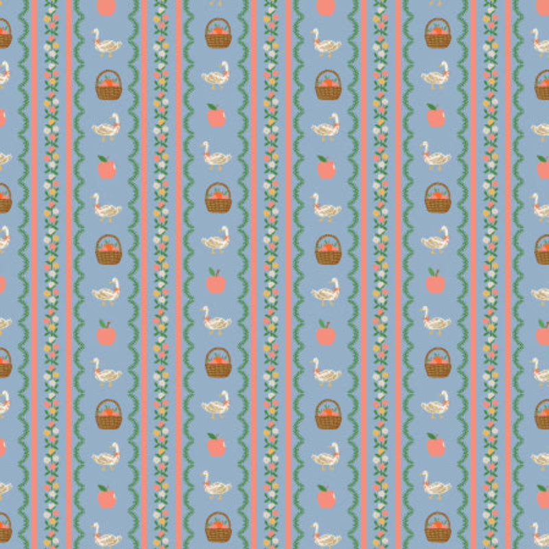 Fabric with geese, baskets apples and colorful stripes on a blue background.