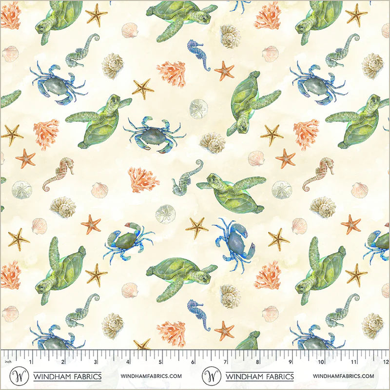 Fabric with turtles, crabs, sand dollars, coral, starfish, and seahorses on an ivory background.
